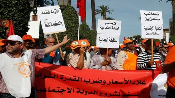 Supporters of the Union National du Travail au Maroc (UNTM - National Labour Union of Morocco) trade union to protest against high cost of living outside the parliament headquarters in Morocco's capital Rabat on October 23, 2022. - The trade union, close to Morocco's islamist Justice and Development Party (PJD) on October 23 mobilised several hundred supporters for the rally after several protests already this week in Rabat and other Moroccan cities. Consumer price inflation was 8.3 percent year-on-year in September, due in large part to surging food prices, which were up 14.7 percent. (Photo by AFP) (Photo by -/AFP via Getty Images)