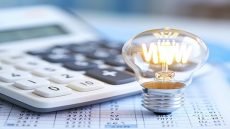Above the electricity bill is a calculator and a light bulb, representing energy consumption.